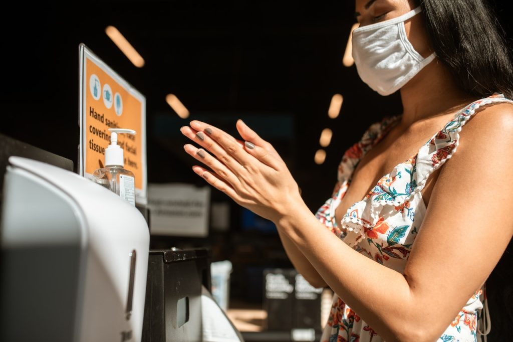 woman disinfecting hands