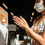 woman disinfecting hands